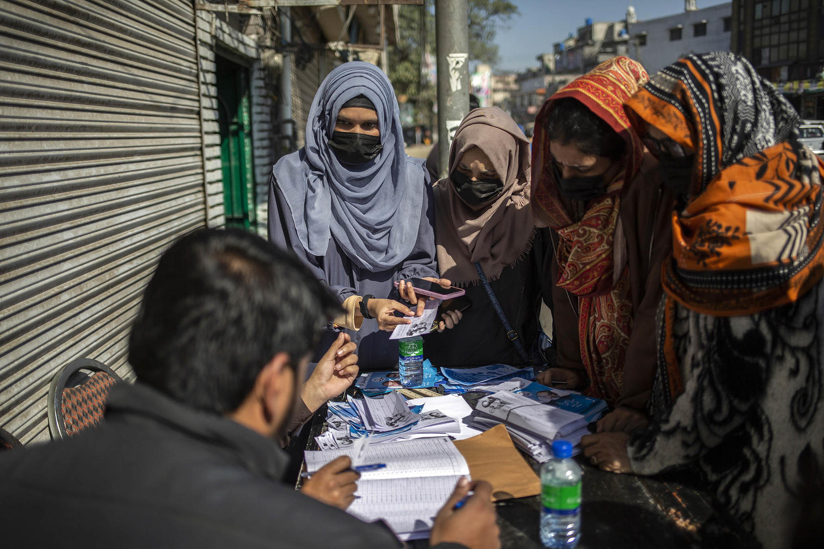 Women gather at a candidateÕs booth in Lahore, Pakistan, on Election Day, Thursday, Feb. 8, 2024. (Saiyna Bashir/The New York Times) digital file - Image 1